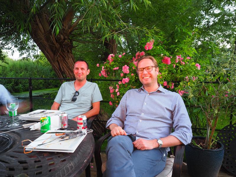 Professor Justin Benesch with a group member at the Summer BBQ 2022